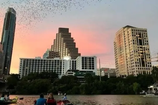a large body of water with a city in the background