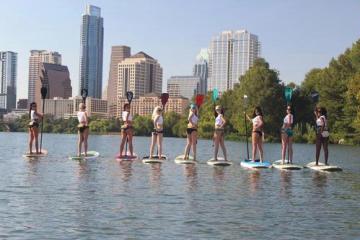 Hooters girls on paddle boards