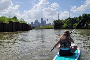 a person standing next to a body of water